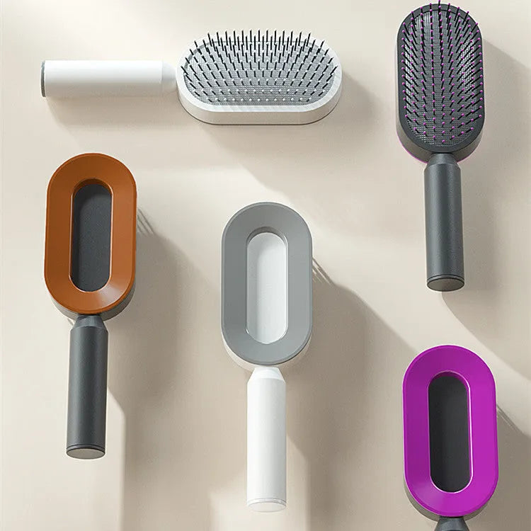 Self-cleaning hair brush with air cushion design in black gold, white, or black purple colours