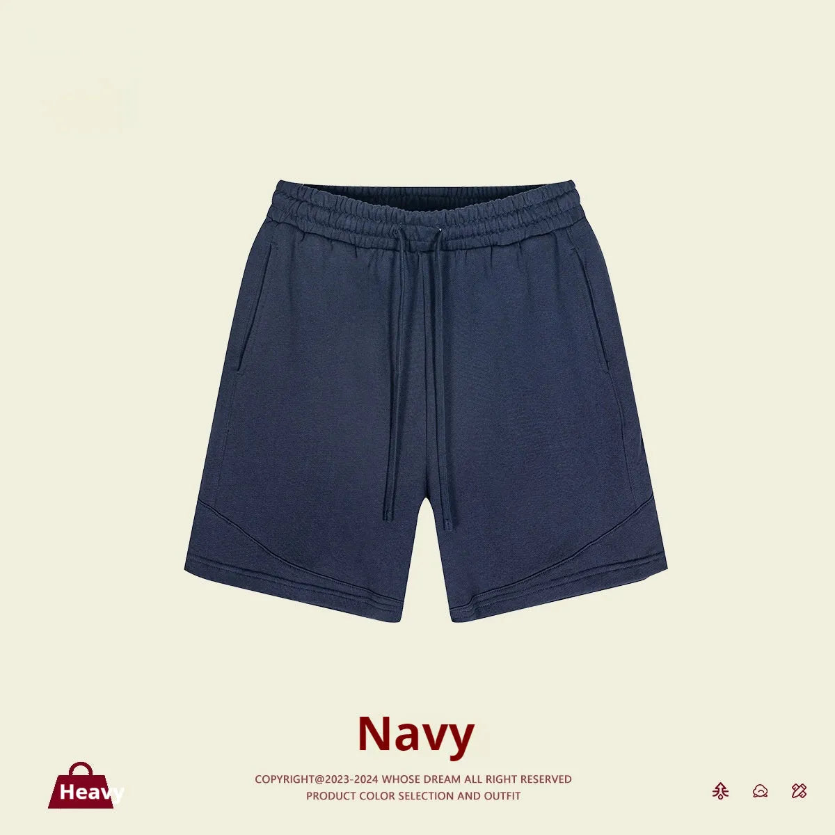Child wearing solid colour loose cotton sports shorts in a neutral shade.