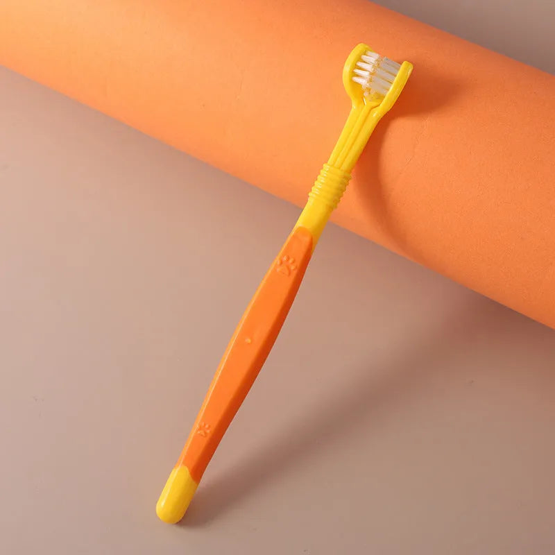 Pet toothbrush with soft nylon bristles on a plastic handle in various colour options for dogs and cats