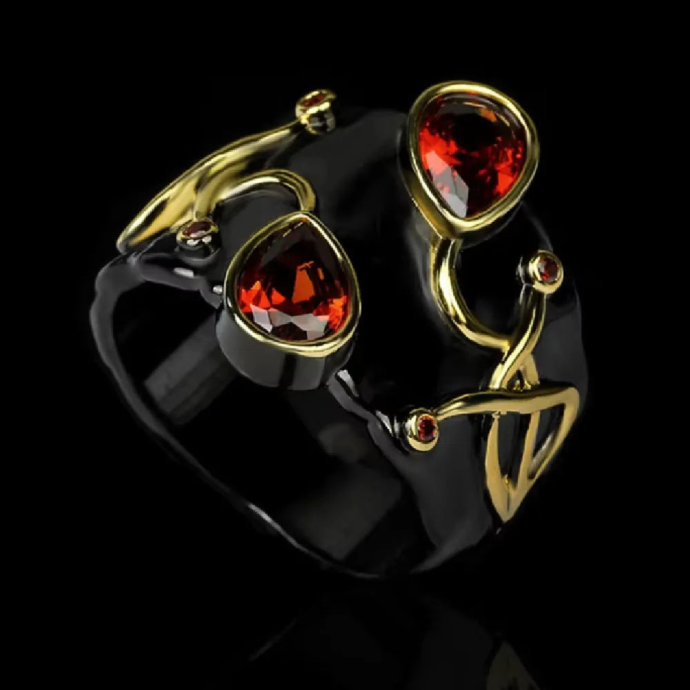 Women's black brass straight-pull oval ring on a neutral background