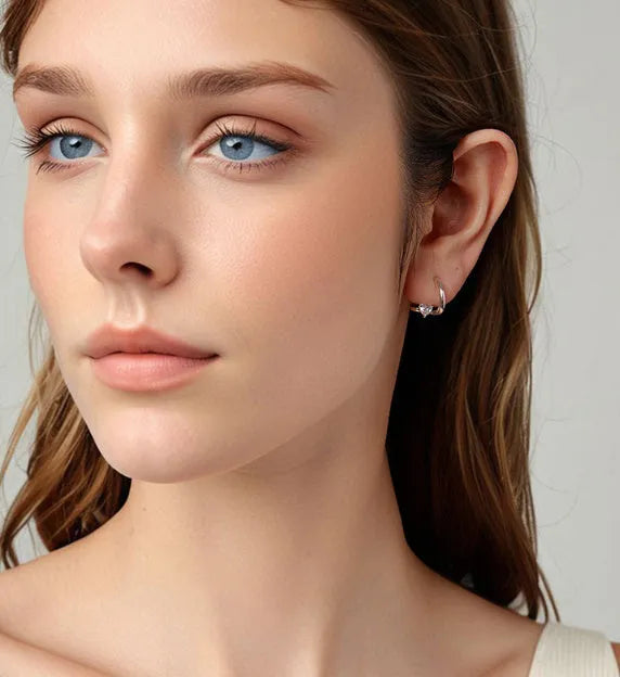 Heart shape love ear clip in 925 silver with polished finish and interwoven design for women