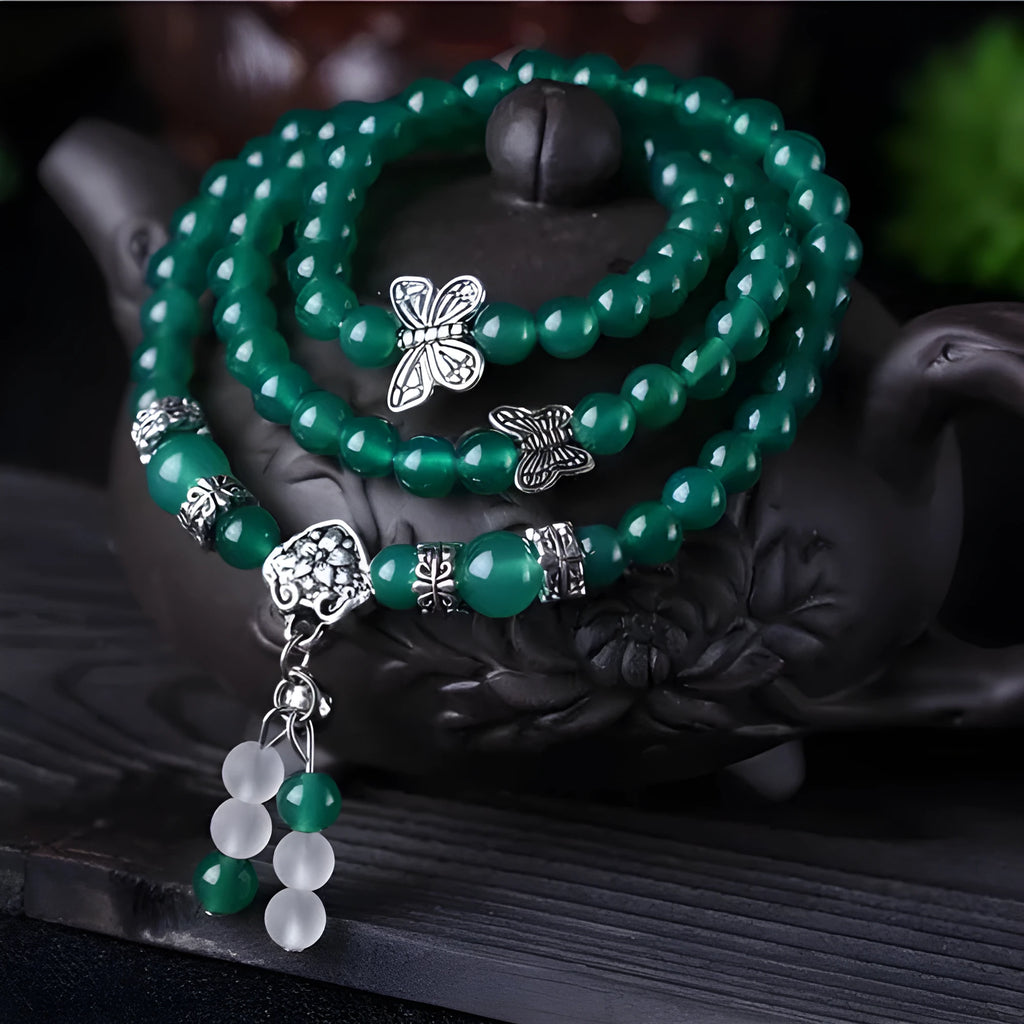 Green agate multi-layer women's bracelet with three circles of 6mm beads on an adjustable chain.