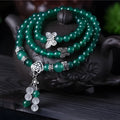 Green agate multi-layer women's bracelet with three circles of 6mm beads on an adjustable chain.