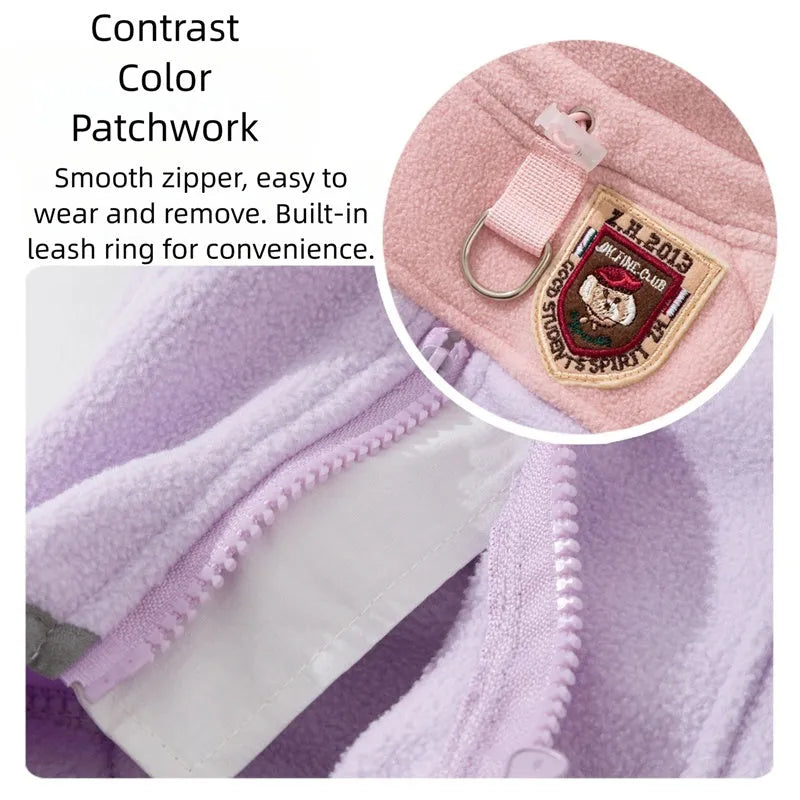 Four-legged fleece pet jacket in colour block design with full zipper and badge patch, sizes S-XXL for cats and small dogs.