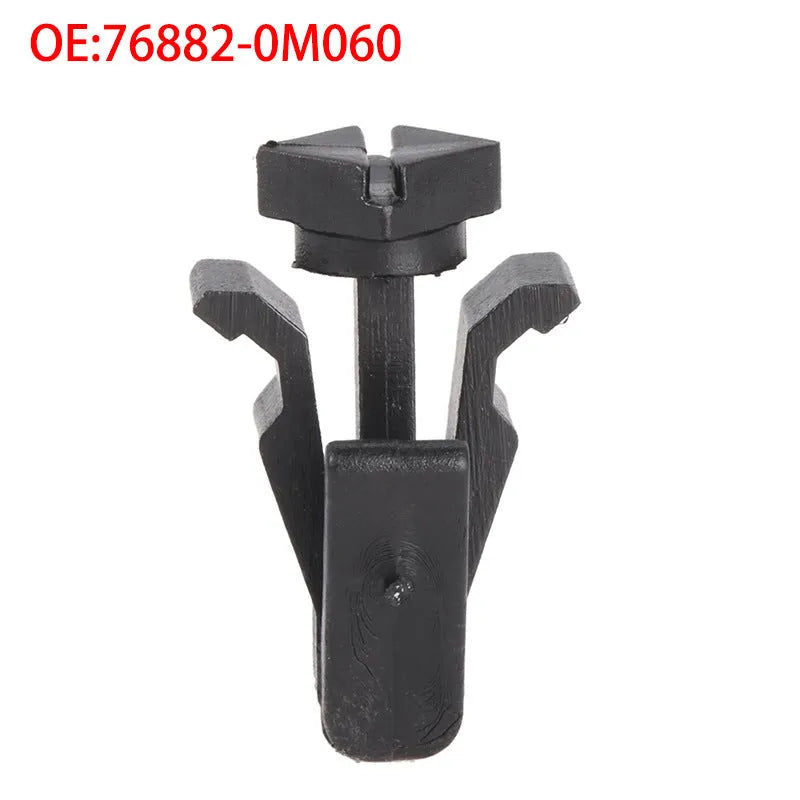 Black automotive fastener clip for Nissan bumper and grille, part number 76882-0M060.