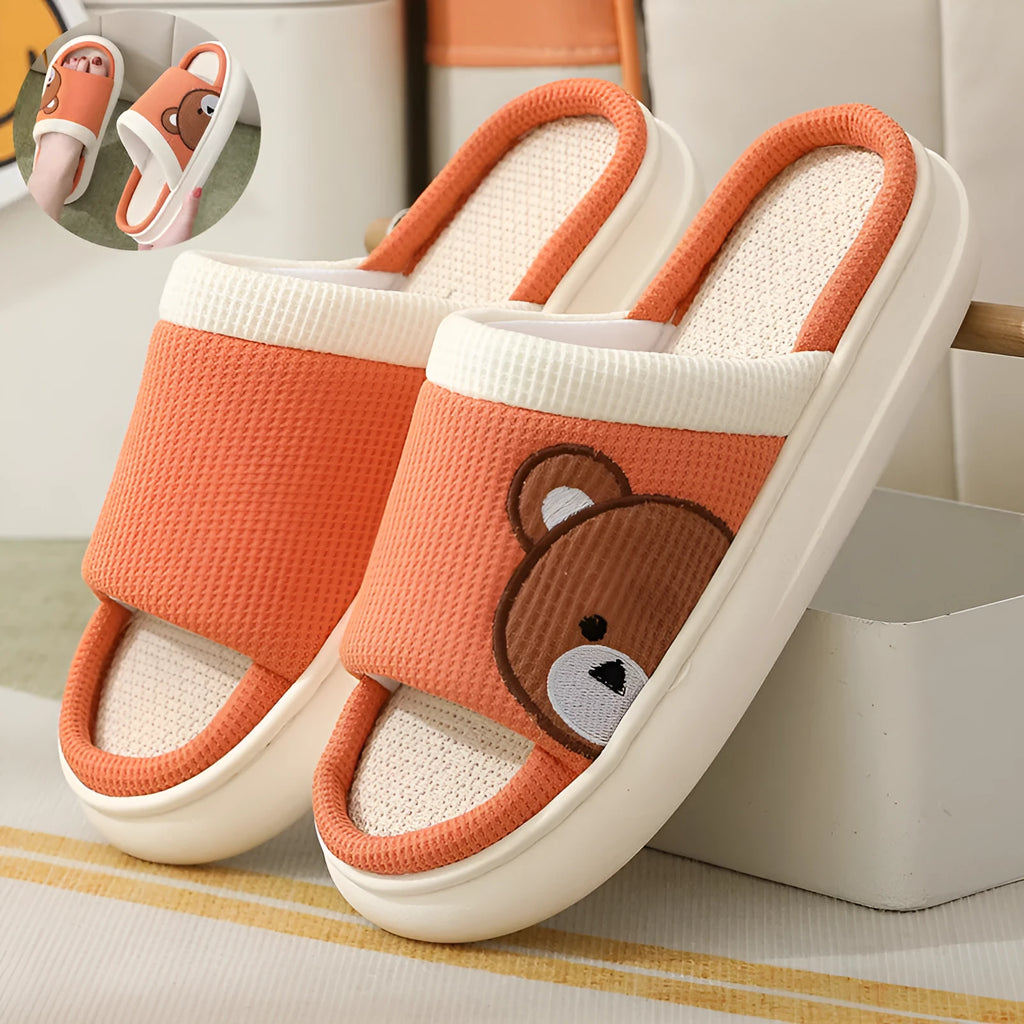 Pair of women's cartoon bear slippers with cotton linen upper and non-slip PVC sole, in light brown colour