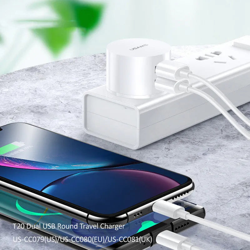 White portable universal dual USB phone charger with UK, EU, and US plugs