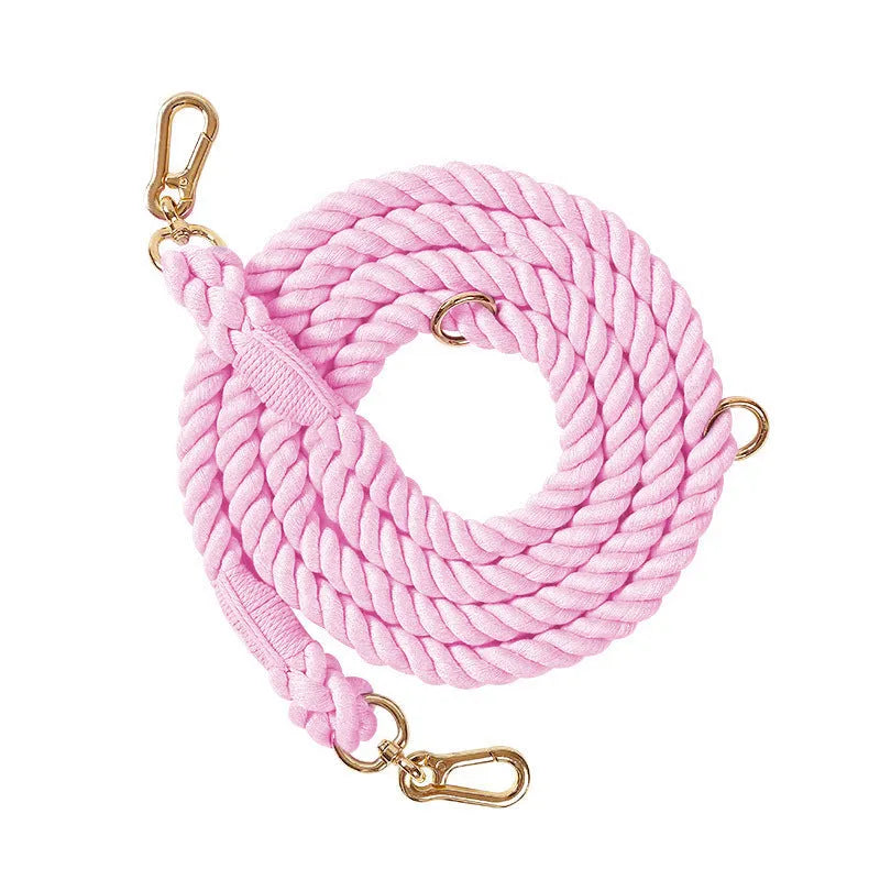 Woven double head dog leash in rainbow colour with gold metal fittings shown at full length