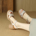Women's apricot open-toe platform sandals with round toe holder and a light-coloured rubber sole on a plain background.