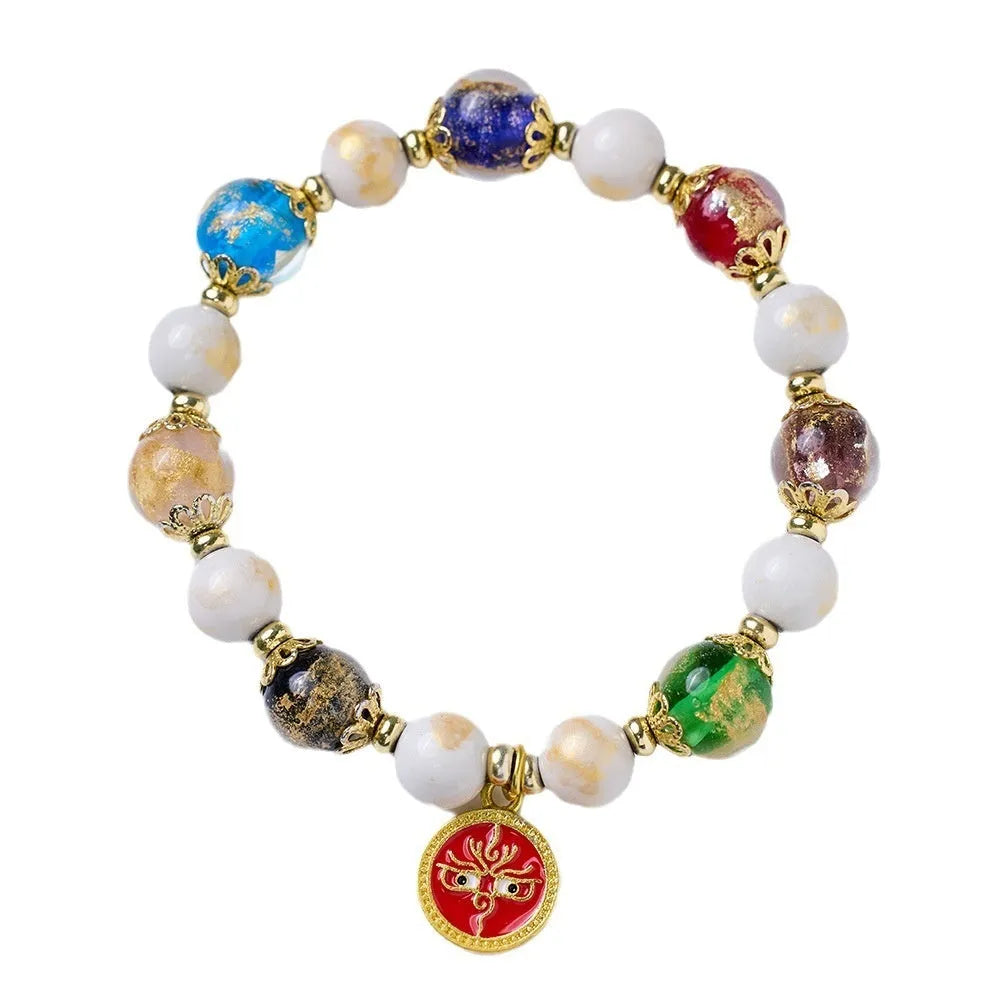 Handmade coloured glaze bracelet with 10mm glass beads showing gods of wealth motifs in national style design