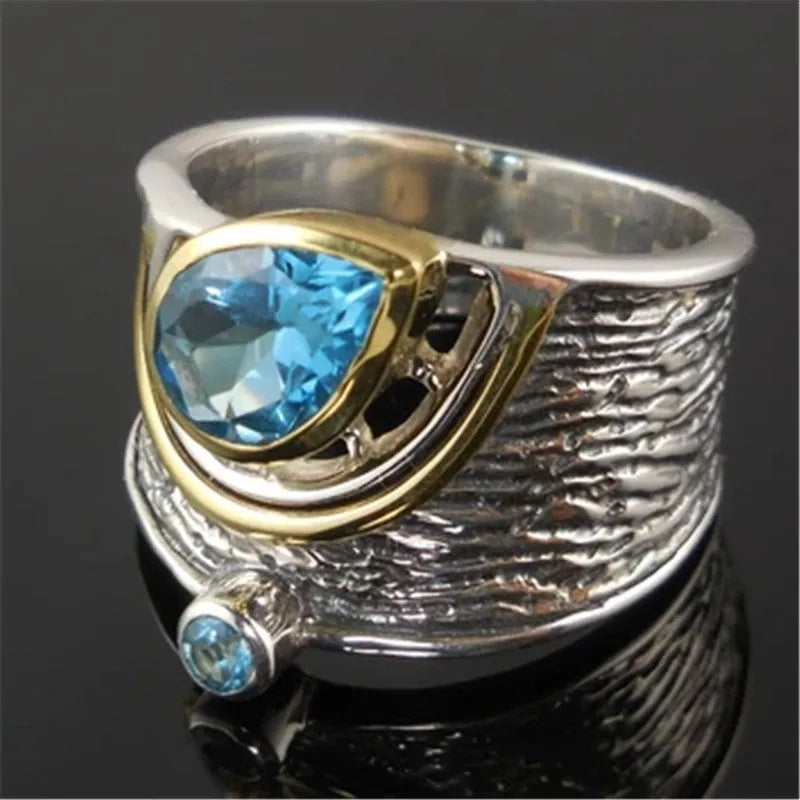 Women's Chinese style drop shape ring with blue rhinestone zircon centrepiece on alloy band