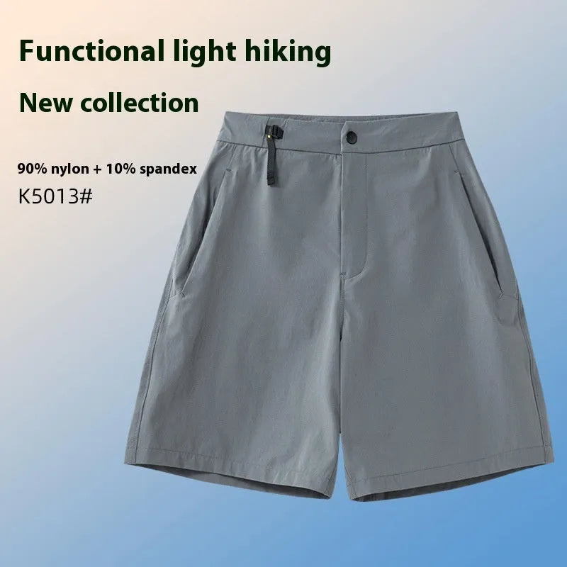 Man wearing khaki 3D cut quick-dry sports shorts with four-way stretch, suitable for running.