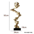 Ran Ran Rose abstract resin sculpture in bright gold, silver, or blue on a neutral background.