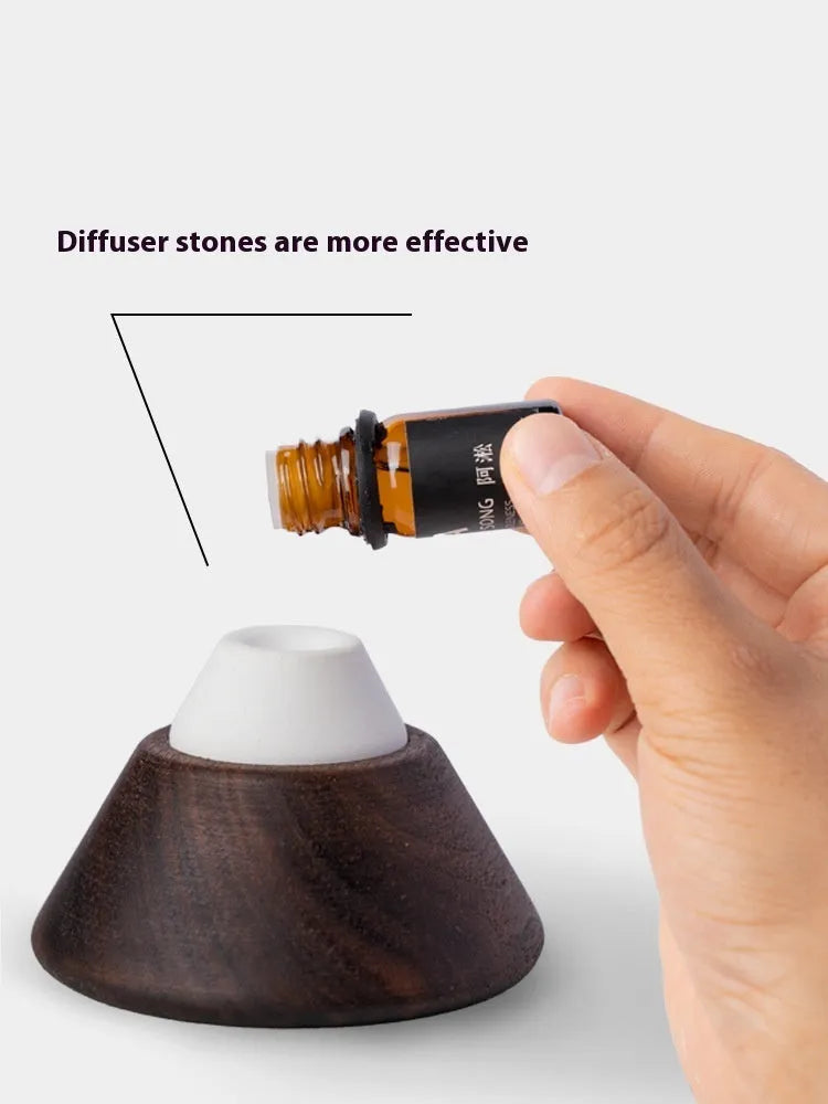 Round solid wood car air freshener with essential oil and anti-slip pad on dashboard