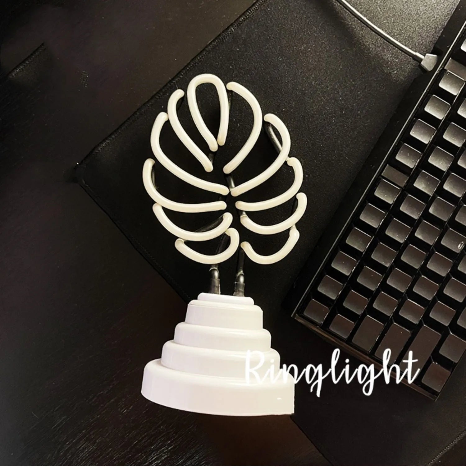 White bamboo-shaped desk lamp with green light, showing USB cable and two size options.