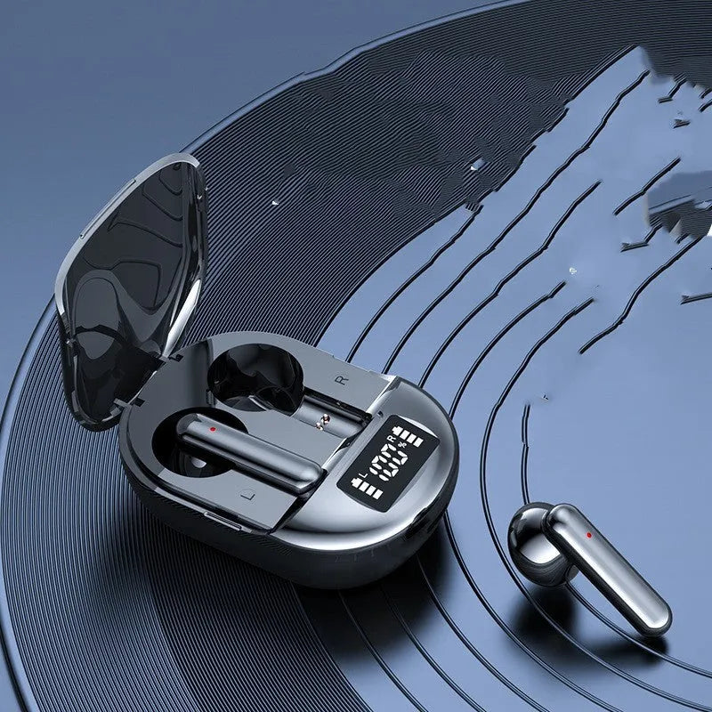 Black and white wireless Bluetooth in-ear headphones with a charging bin showing digital display.