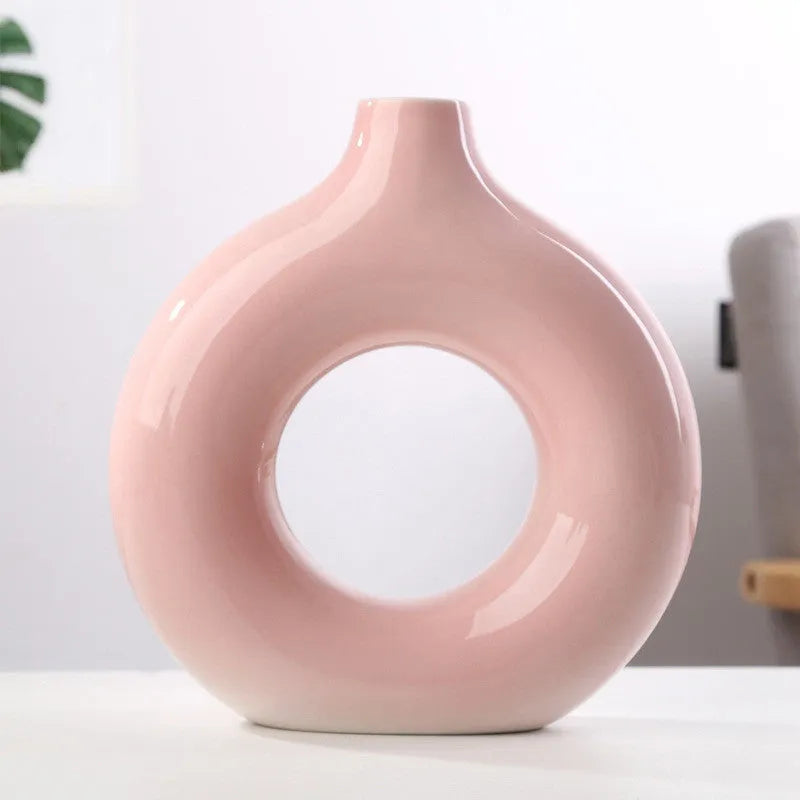 A simple modern frosted porcelain biscuit vase in a neutral colour, for flower arranging.
