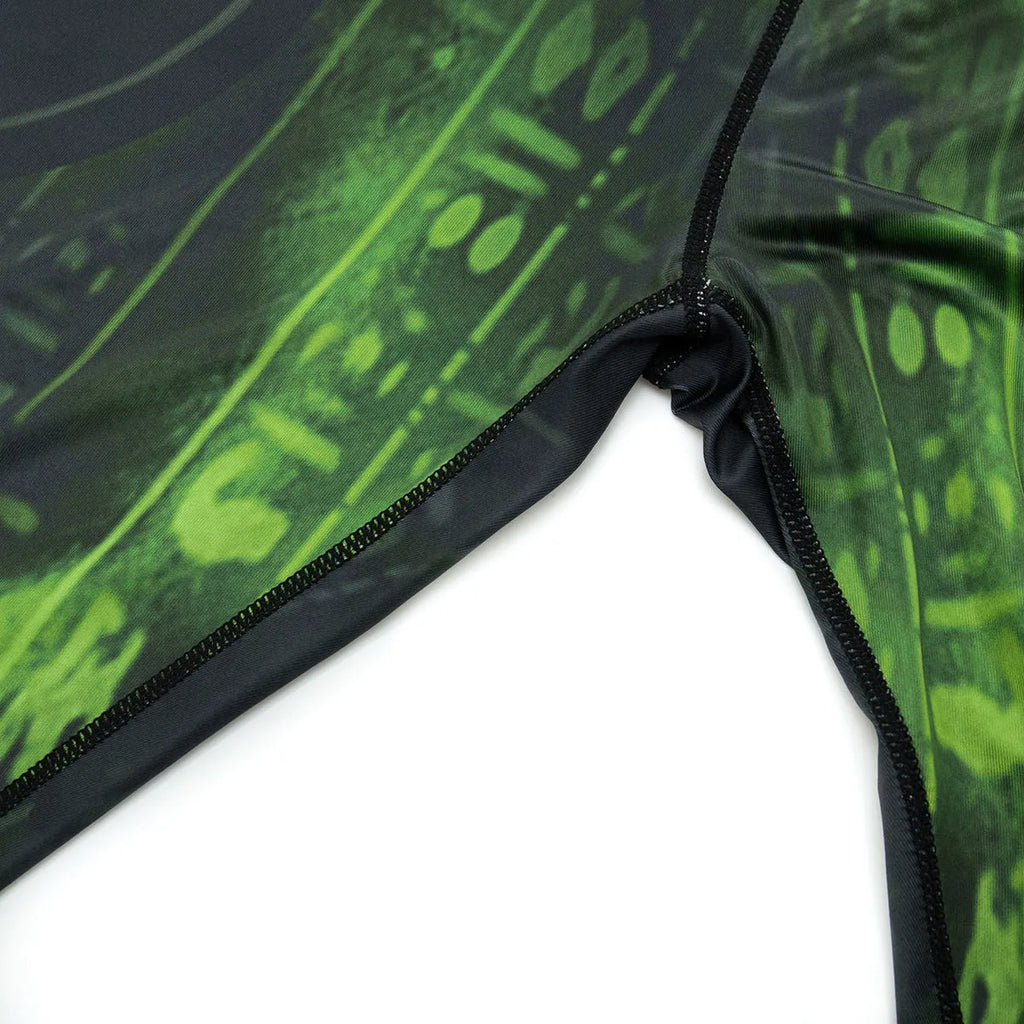 Man wearing a slim fit, printed ZF016 long sleeve sports top and matching trousers for running.