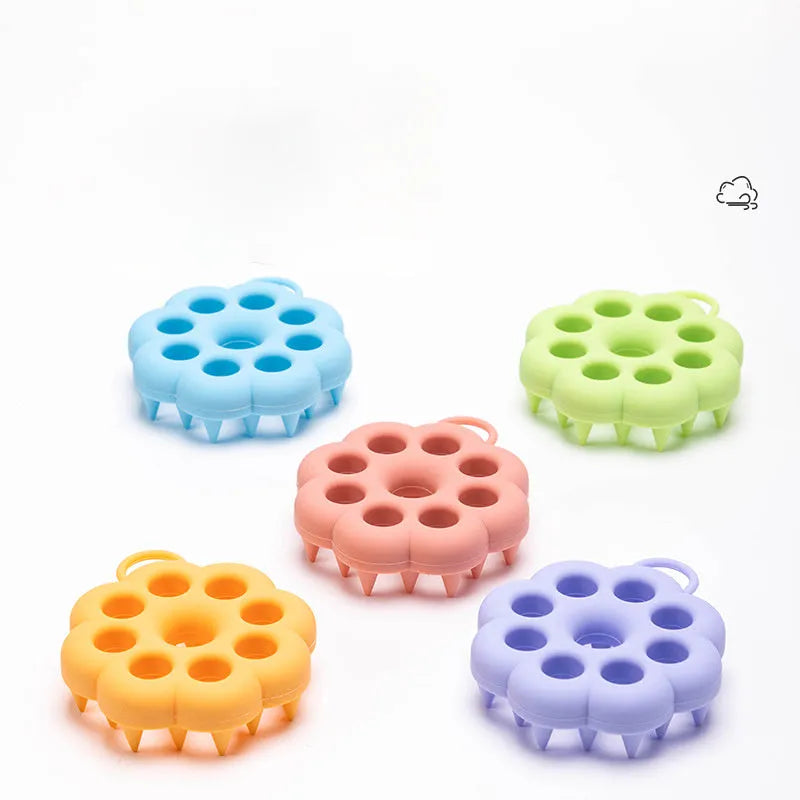 Silicone pet grooming brush with ergonomic handle shown in blue, for use on dog or cat coat during dry grooming or bath.