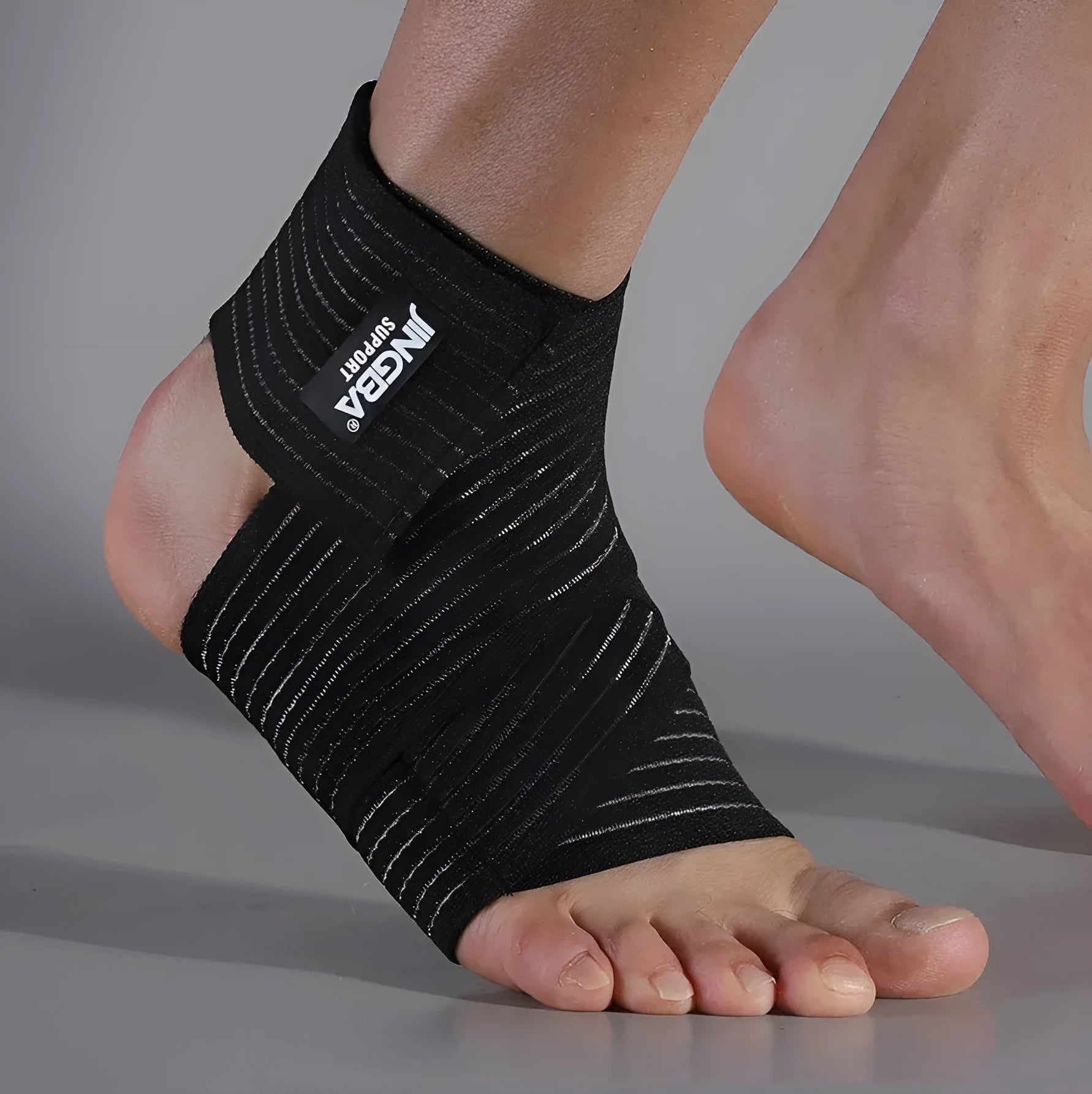 Adjustable sports ankle support bandage in black and khaki colours for multiple athletic activities