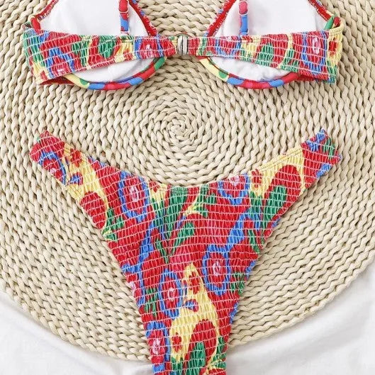 Red floral print women's underwire bikini top and briefs on a mannequin.