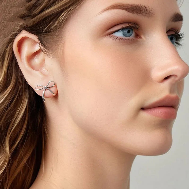 Simple S925 sterling silver stud earrings with polished finish on white background
