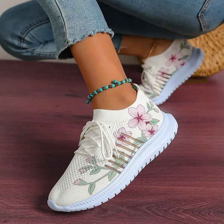 Women's Milky White mesh Flyknit running shoes with a round toe and flat rubber sole.