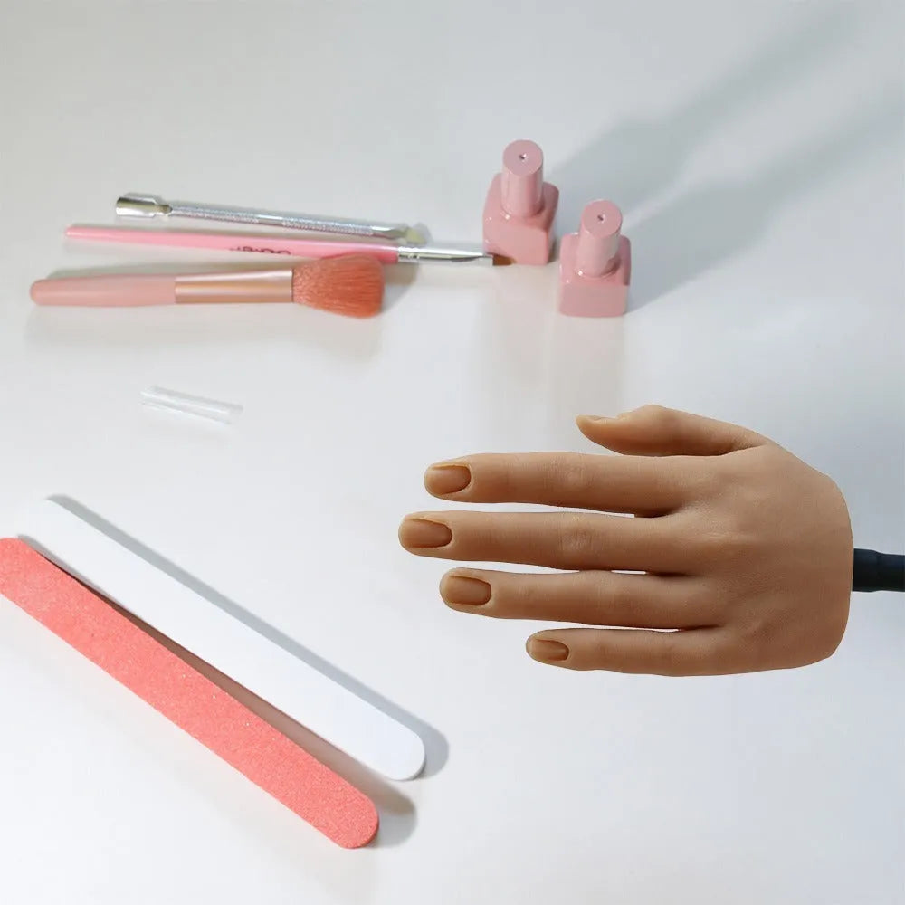 Silicone nail practice hand model with coloured nail tips on fingers for manicurist training.