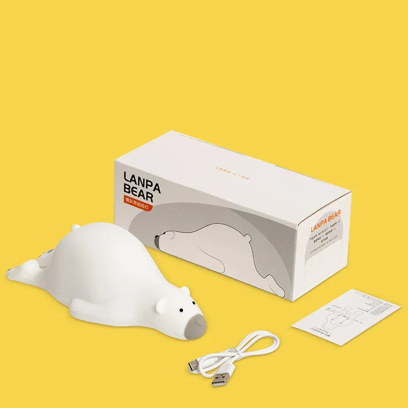 White bear silicone night light on bedside table with soft glow USB rechargeable children's lamp