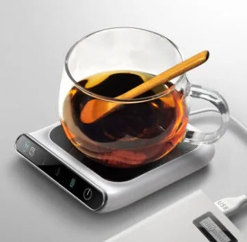Black USB cup warmer with temperature controls and reminder light on desk