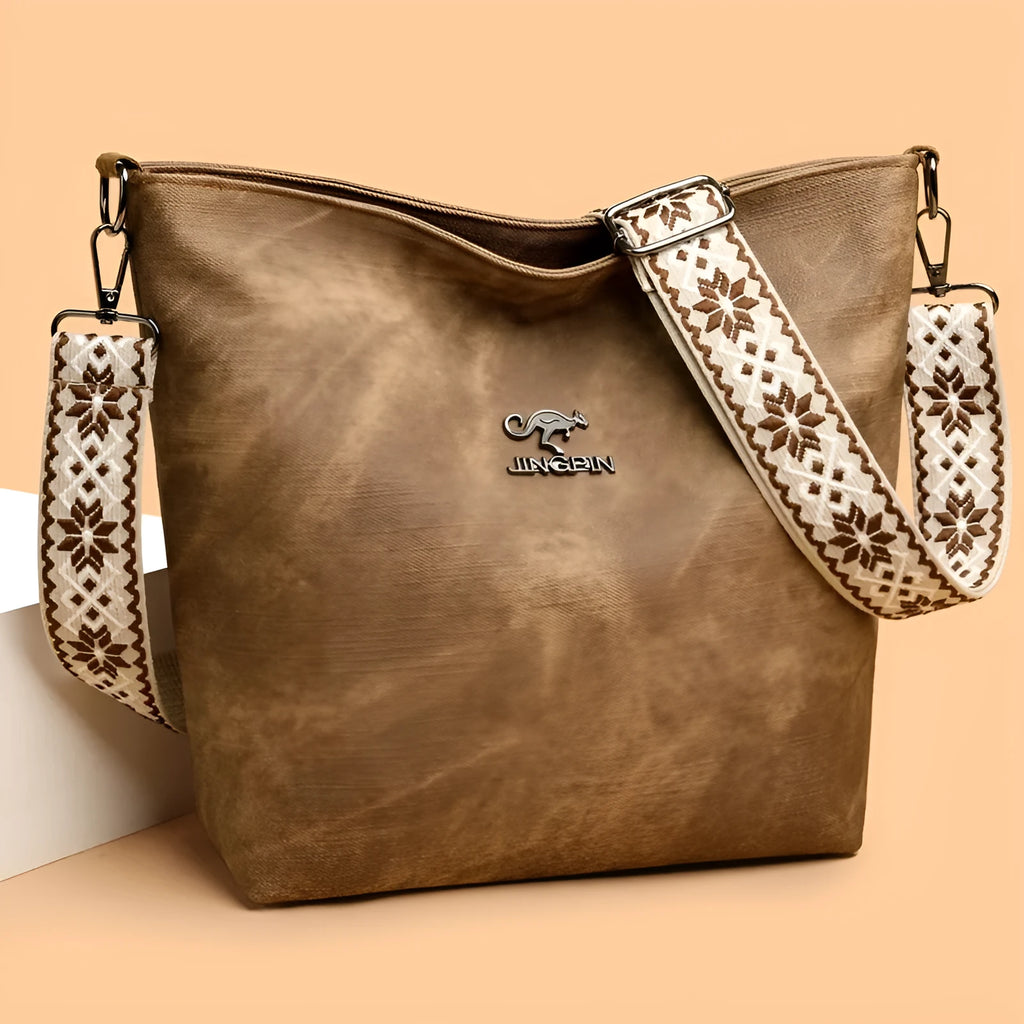 Soft PU leather crossbody shoulder bag in pink colour with large main compartment and single strap