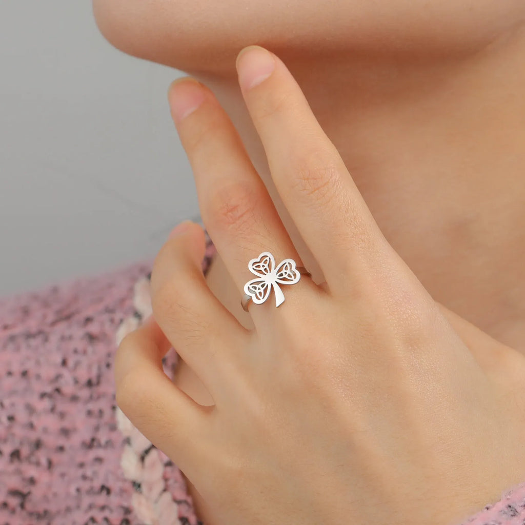 Stainless steel hollow ring shown in gold and steel colour finishes on hand