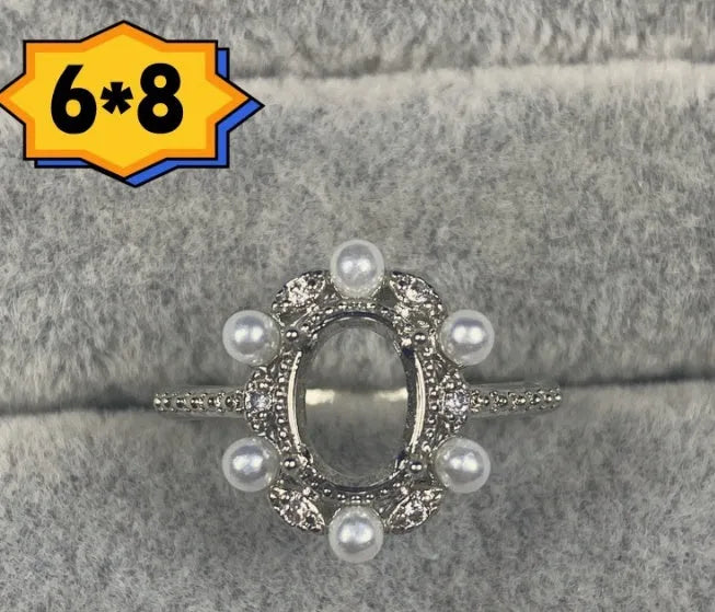 Oval denier open mouth ring with 6x8mm stone and five-pointed star on electroplated copper band.