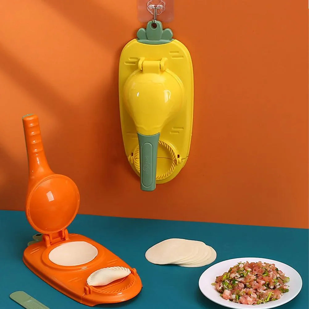 Orange and white plastic manual dumpling maker tool with press and mould.