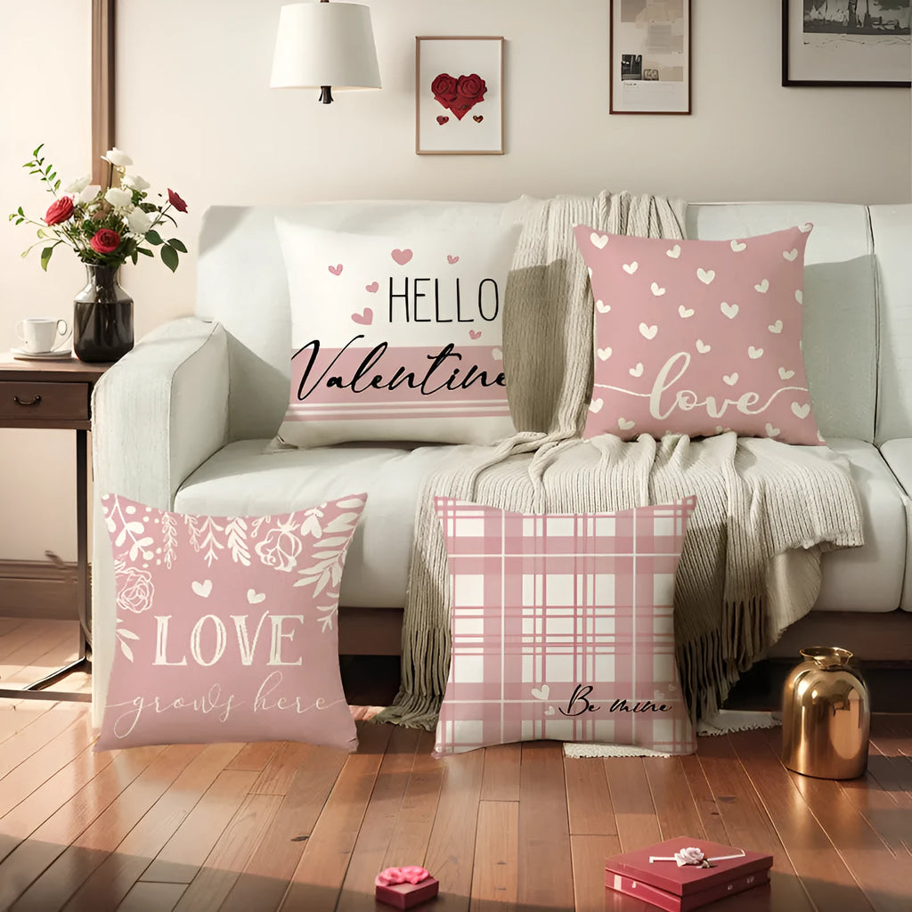 Square red and white plaid cushion cover with heart motifs, measuring 45cm, on a grey sofa.