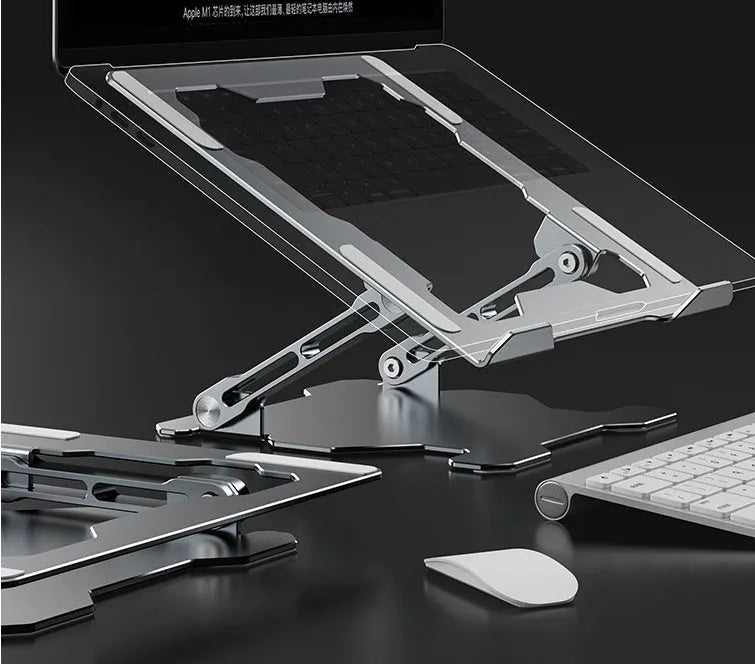 Grey aluminium adjustable and foldable laptop stand on a wooden desk.