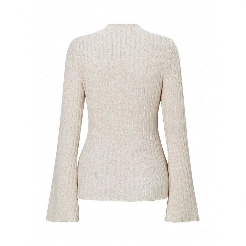 Long sleeve casual top in black with lantern sleeves and a sunken stripe pattern, laid flat.