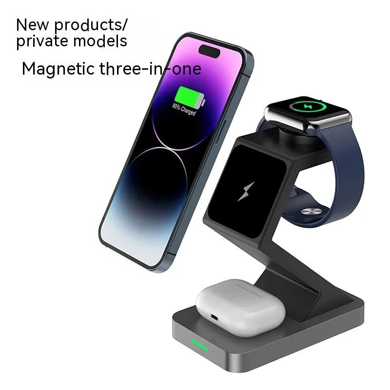 Three-in-one magnetic wireless charger phone holder in black with phone, watch and earbuds on a desktop
