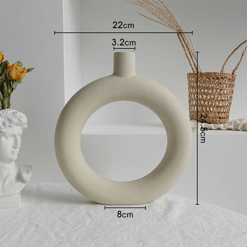 Unglazed matte ceramic vase for dry flower arrangements in Nordic style