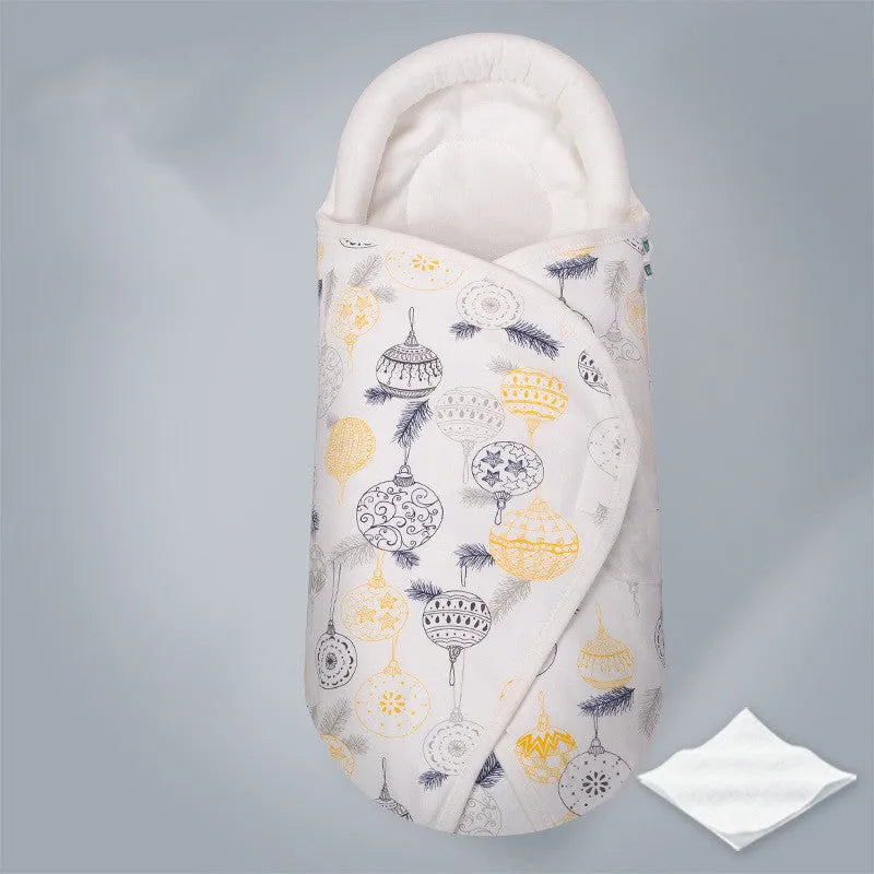 Cotton baby anti startle swaddle measuring 30 by 60 centimetres in a colourful print design.