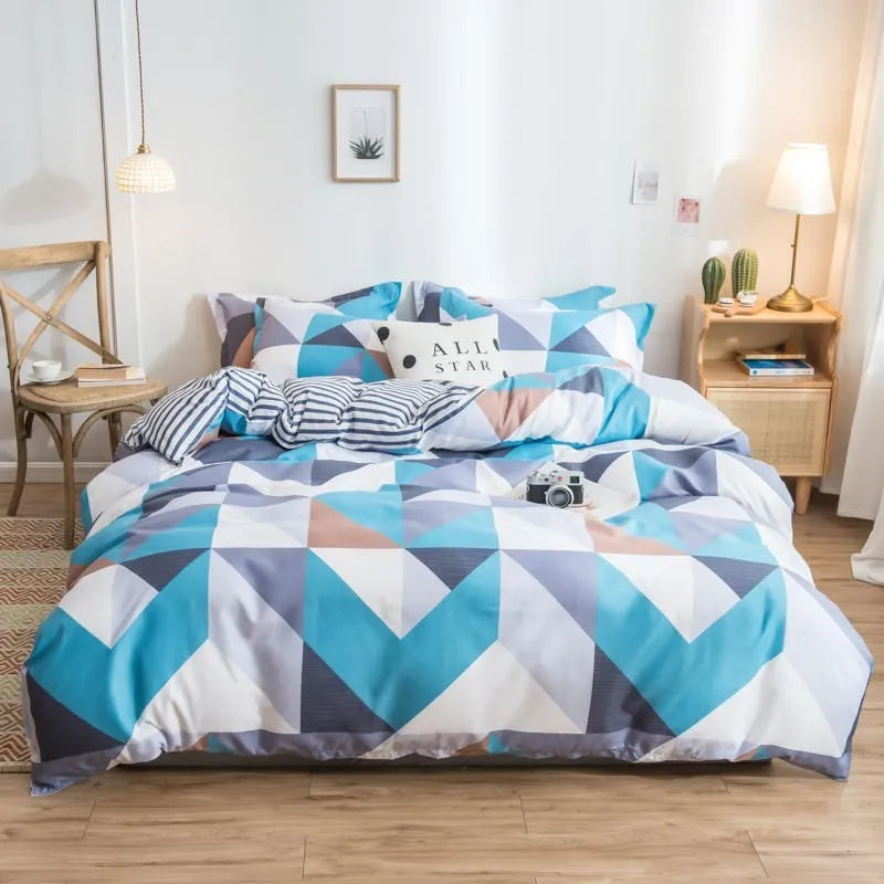 Cotton duvet cover and fitted sheet bedding set in a colour option, shown on a bed