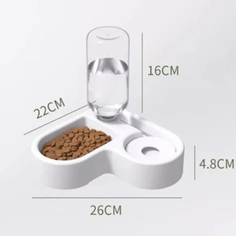 White plastic pet water fountain with electric pump on a floor.