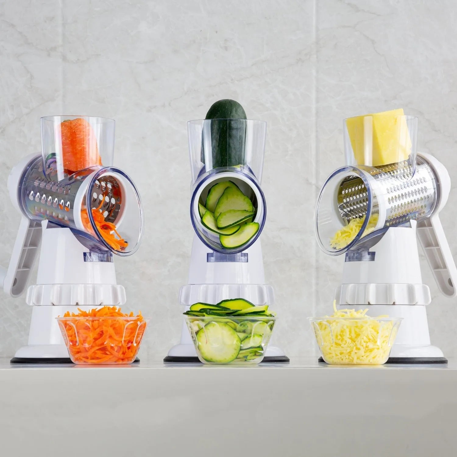 3 In 1 manual vegetable slicer in white BPA-free plastic with stainless steel blades and suction feet