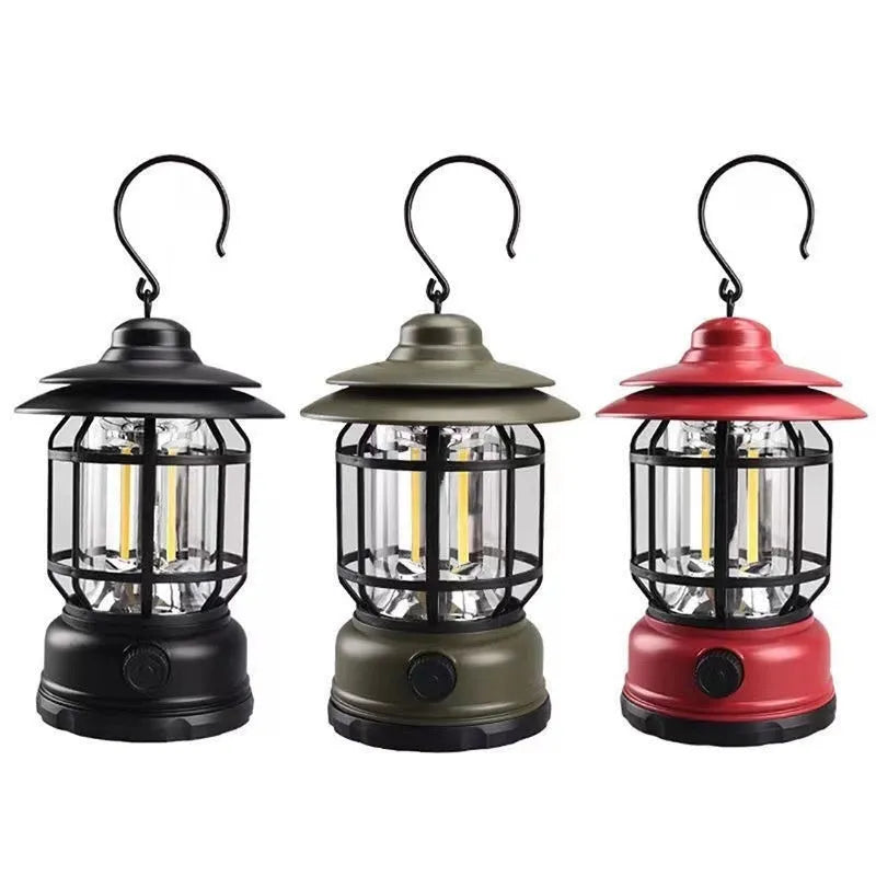 Portable head lamp camping lantern in dark green, showing compact size for hands-free use.