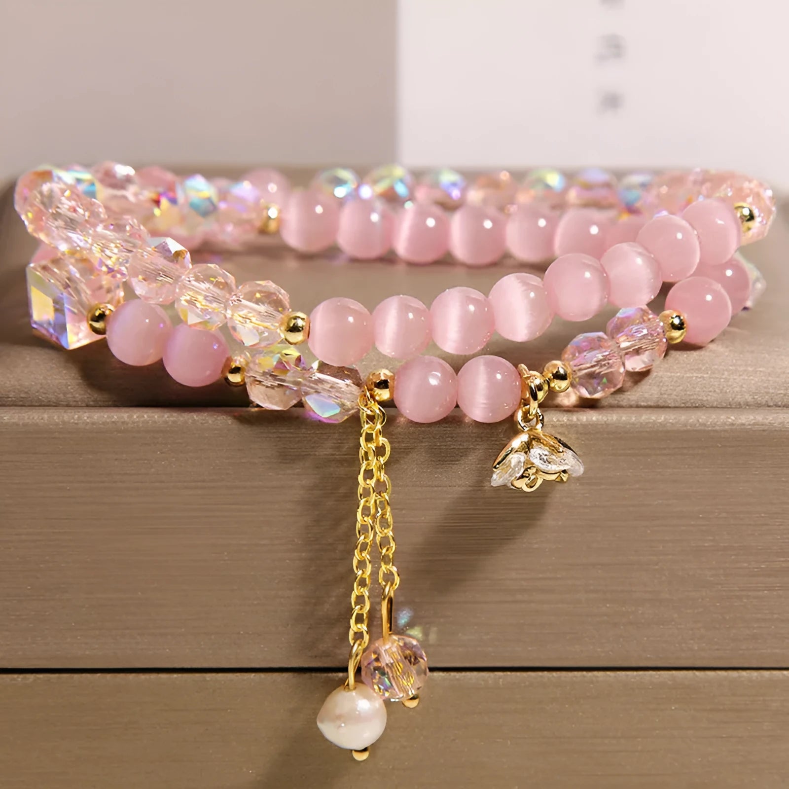 New Chinese style gold-plated double ring bracelet with pink cat eye crystal and zircon small flower detail