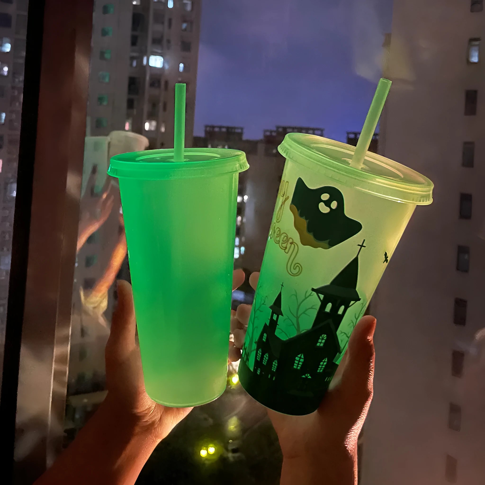 Halloween-themed luminous plastic straw cup with a 720ml capacity on a white background.