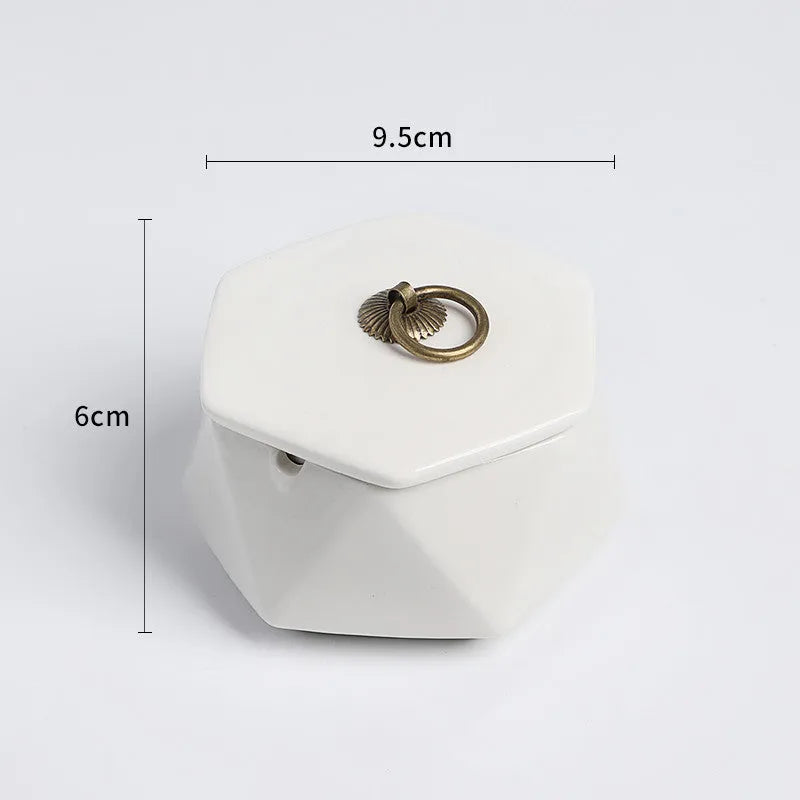Ceramic ashtray with lid, Nordic style, available in multiple colours, on a tabletop