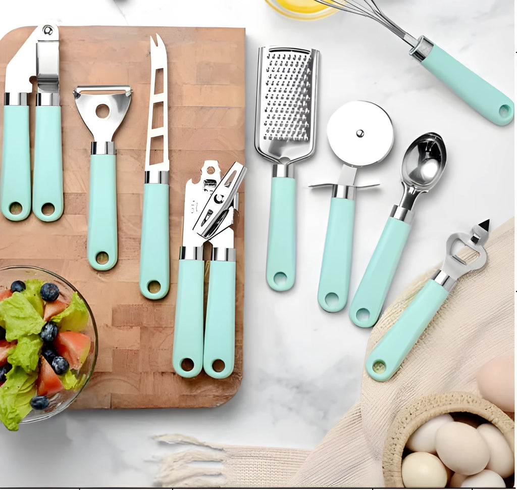 Kitchen utensil set with stainless steel heads and plastic handles including grater, whisk, and can opener