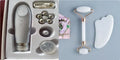 White jade facial roller and gua sha scraping board set on a table.