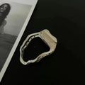 Gold and silver zinc alloy hair barrettes showing arc, square, and triangle shapes on a plain background.